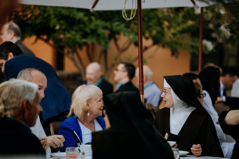 nuns and others at table