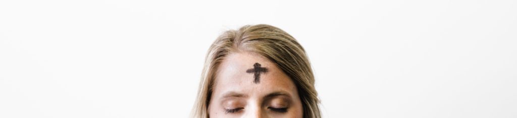 A woman with a cross of ashes on her forehead